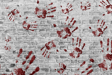 Red hand print on White Brick wall background
