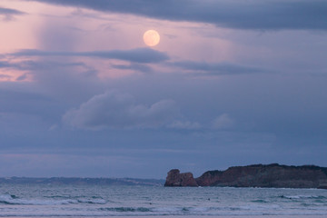 Hendaia's beach with full moon before eclypse at the Basque Country
