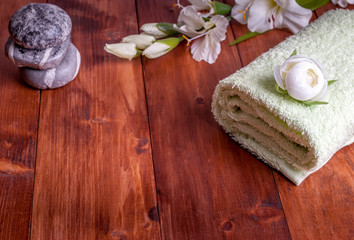 Obraz na płótnie Canvas Towel and stack of spa stones