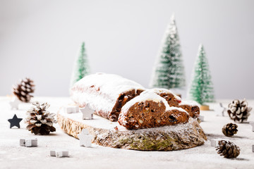 Christmas or New Year pastries Holidays Concept Dresdnen Stollen Chocolate Traditional German Cake Gift Fruit Cake Holiday , European festive dessert Decoration selective focus