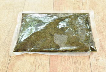 stir fried pickled mustard or Gan Lan Cai Chinese food made from cabbage and black olive in oil with plastic packaging