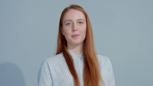slowmotion portrait pretty gingerhead model smiling to the camera