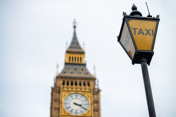 Fototapeta na wymiar Street lamp with taxi stop in London