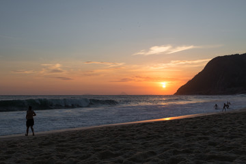 Naklejka na ściany i meble beautiful sunset on the beach of itacoatiara in niterói, rio de janeiro, brazil