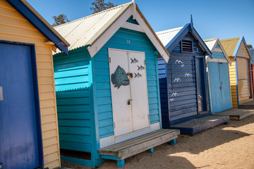 Fototapeta na wymiar Colorful huts on the beach