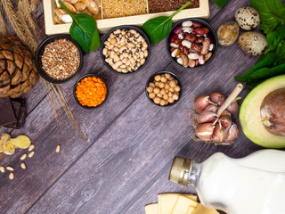 Fototapeta na wymiar Healthy food - legumes, nuts, seeds and vegetables, dairy product, copy space