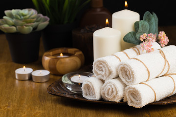 Spa still life with aromatic candles, flower and towel. - Image.