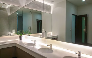 Faucets with washbasin and big mirror © Rawich Liwlucksaneey