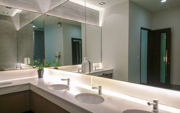 Faucets with washbasin and big mirror