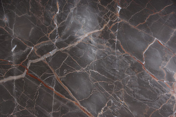 Brown marble with pink and red veins, called Caravaggio