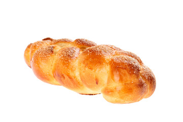 Traditional Bulgarian sweet leavened bread Kozunak, braided and sprinkled with sugar, isolated on white. In Bulgaria Kozunak is mainly prepared for Easter, but can be found in bakeries year round