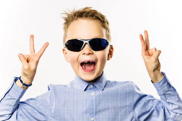 happy boy without a front tooth smiling over white background