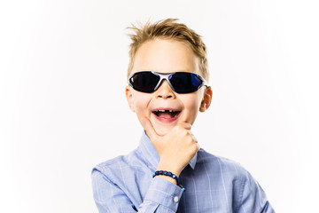 happy boy without a front tooth smiling over white background