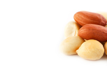 Obraz premium Peanuts isolated on white background. Peeled Peel and Scarlup.