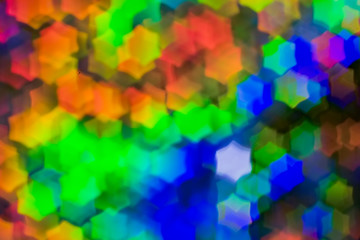 Bokeh, abstract colorful background of defocused hexagon stars. Festive lights and flicker