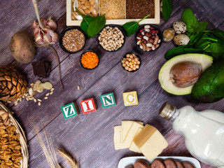 text Zinc, Ingredients or products containing zinc and dietary fiber on wooden board, natural sources of minerals