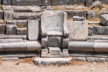 Prohedria marble seat at ruined theatre of Priene ancient site in Turkey.