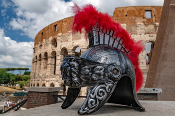 metallic gladiator helm on rome coliseum background