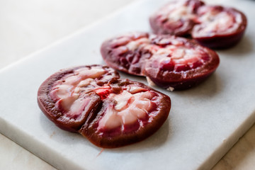 Sliced Raw Lamb Kidney on Marble Board.