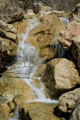 Waterfall across rocks from front - La Hoz