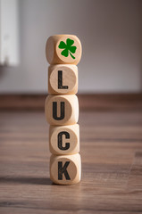 Cubes dice with Luck and shamrock or cloverleaf