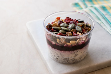 Healthy Chia Pudding with Pumpkin Seeds / Acai Bowl in Plastic Cup