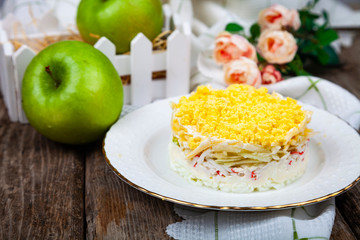 Delicious salad with crab sticks and apples