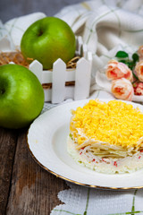 Delicious salad with crab sticks and apples
