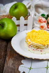Delicious salad with crab sticks and apples