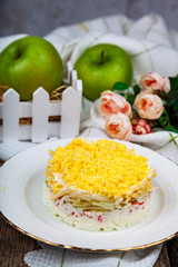 Delicious salad with crab sticks and apples