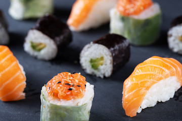 Fresh seafood sushi meal on darck background