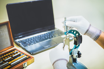 Micrometer Calibration with gauge block in laboratory.