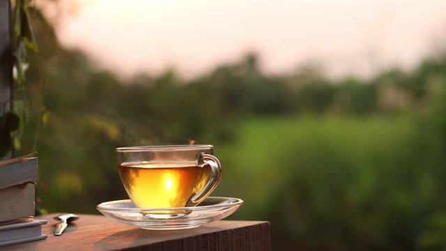 Hot tea on wooden in the evening