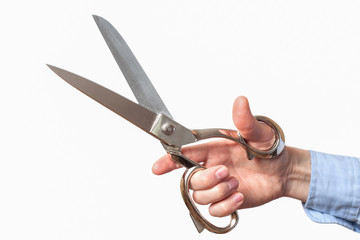 Old scissors in hand. Isolated on white background. Vintage scissor