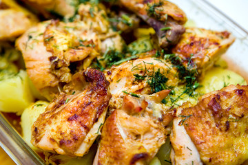 grilled chicken meat with potatoes sprinkled with greens