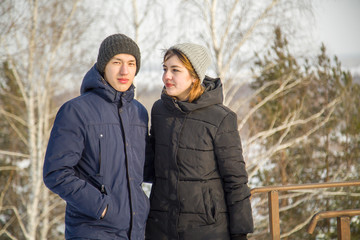 Fototapeta premium young couple walking in winter park