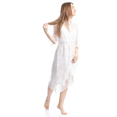 Fototapeta premium Woman in white dress summer spring laced goes on white background isolation