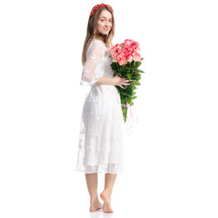 Woman in dress with flowers roses in hand on white background isolation