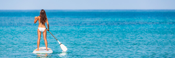 Paddle board stand-up paddleboard beach lifestyle banner. Bikini girl stand up sup paddleboarding...
