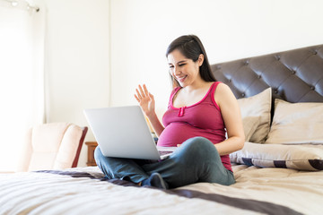Fototapeta na wymiar Sharing Pregnancy News Through Video Call