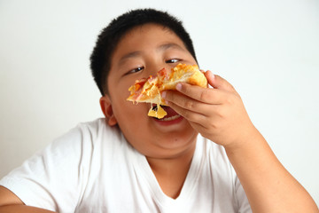 Fat boy eating pizza