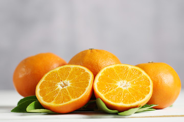 Fresh oranges fruit on white table background.