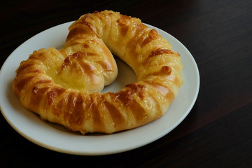 Heart shape sweet bread on white dish and space for write wording, special recipe and design for coming valentine’s day, promotion strategy for up selling in special season greeting