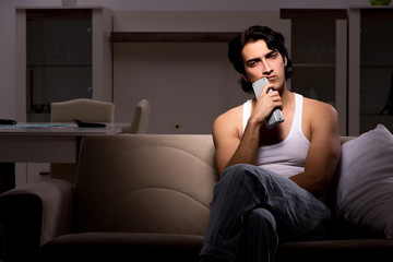 Young man suffering at home night time