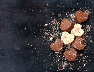 Valentines day background, chocolate dark and white hearts