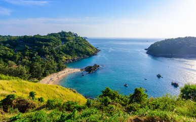 Obraz premium Sunset over Promthep Cape and Yanui beach. Tropical coast with paradise beaches on Phuket, Thailand.