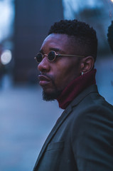 Young fashionable man posing for stylish urban photo shoot 