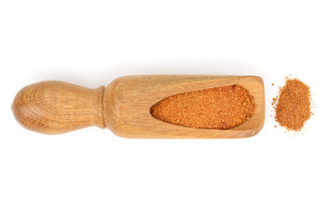 Mixed spices on wooden scoop isolated on white background. Top view. Flat lay