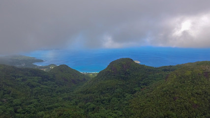 Mountain and ocean of Seychelles on a foggy day