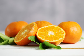 Fresh oranges fruit on white table background.